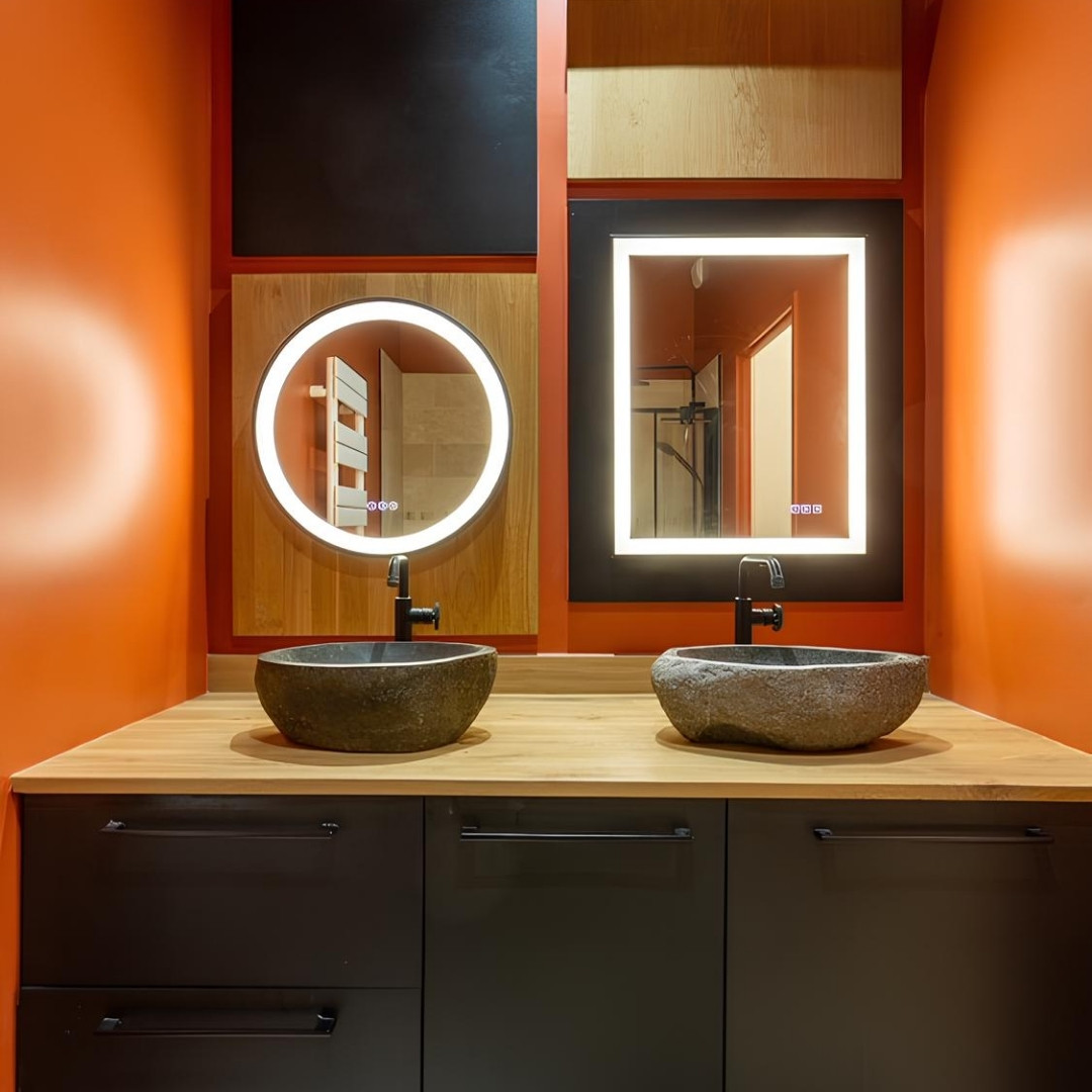 Orange chaleureux, bois et pierre brute : cette salle de bain est un vrai concentré de lumière et de caractère ✨  Les murs font dégager une énergie solaire dans toute la pièce et la robinetterie noire mat apporte juste ce qu’il faut de contraste 🧡  On se dit qu’on resterait bien là quelques minutes de plus lorsque l'on se trouve dans cette belle salle de bain 🥰  Bravo at:qualirenovation__travaux pour ce résultat réussi 👏  #essebagno #democratikdesign #faucet #robinetterie #bathroomdesign #salledebain